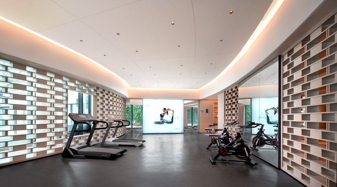 Adult beginners enjoying Muay Thai pad work class at Sabai Muay Thai Kallang gym